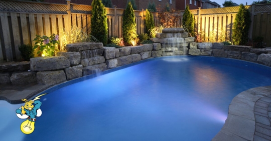 A residential pool at night.